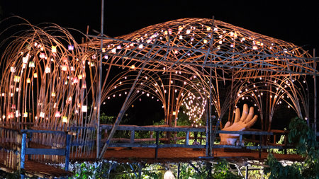 Ratchaburi, Thailand : Night illumination in the form of a human hand in a bamboo cage, Baan Hom Thian.の写真素材