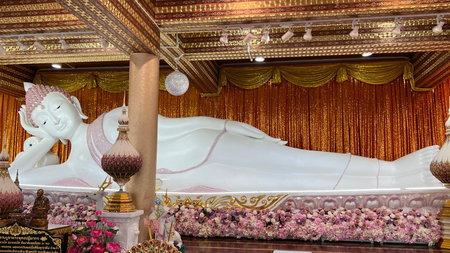 Beautiful white reclining buddha statue at Wat Phra That Pha Sorn Kaew, Petchabun, Thailandの写真素材