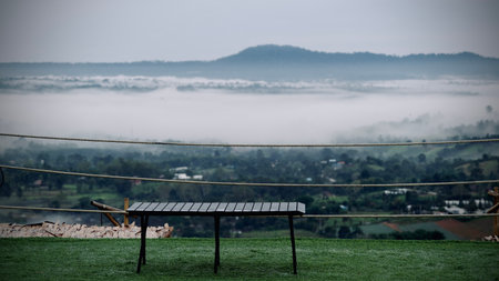 Morning mist blankets the valley and mountain view in Thailand.の写真素材