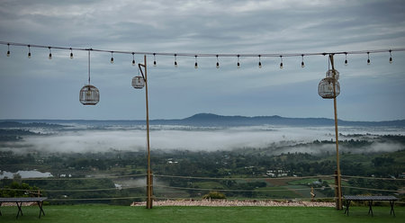 Misty mountain with wooden bamboo lamppost.の写真素材