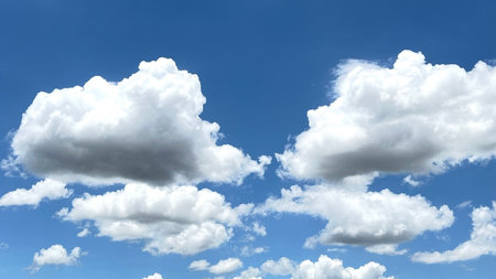 White cumulus clouds against blue sky, cloudscape in the skyの写真素材