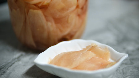 Pickled ginger in a glass jar. Selective focus. Close up.の写真素材