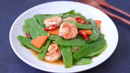 Stir-fried snow peas with shrimp and chiliの写真素材