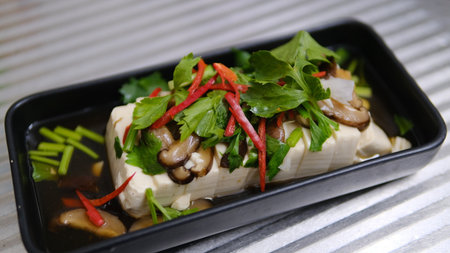 Steamed tofu with with mushroom and vegetable in soy sauceの写真素材