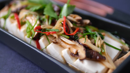 Sliced tofu with oyster mushrooms and vegetablesの写真素材