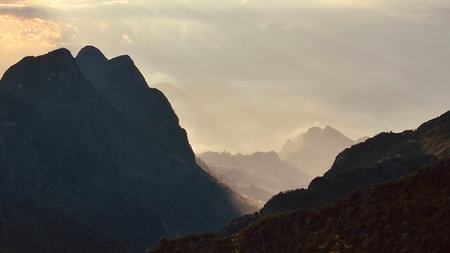 Stunning sunset view with dramatic sun rays over the Doi Luang Chiang Dao mountain range, Chiangmai, Thaiand, adventure concept.の写真素材