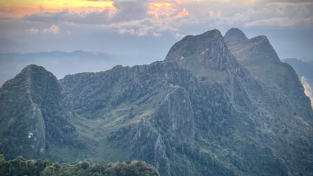 Stunning sunset view with dramatic sun rays over the Doi Luang Chiang Dao mountain range, Chiangmai,...