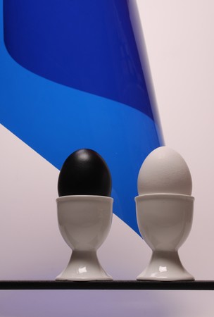 A black and a white egg  on a lineの写真素材