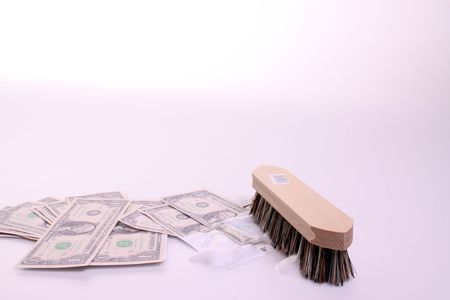 Money getting washed bij brushの写真素材