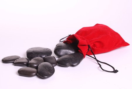 Massa stones with a red bagの写真素材