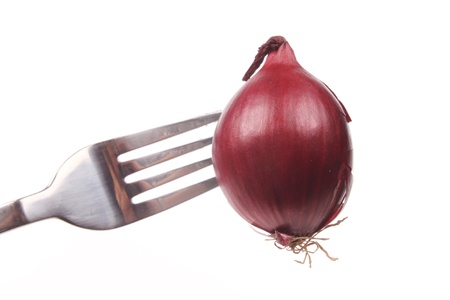 Red onion  on a fork isolated over white backgroundの写真素材