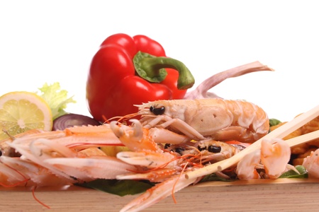 Cooked scampi on a dish  against a white backgroundの写真素材