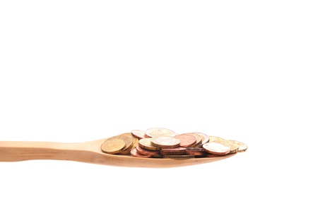 money simply offered on a wooden spoon isolated on a white background の写真素材