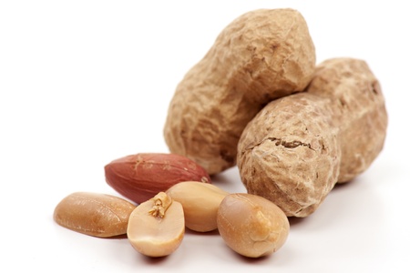 Dried roasted peanuts on a white background 