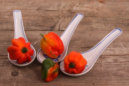 Chili peppers on an rustic wooden table