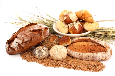 Fresh baked bread and wheat in a studio setting