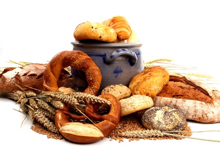 Fresh baked bread and wheat in a studio setting