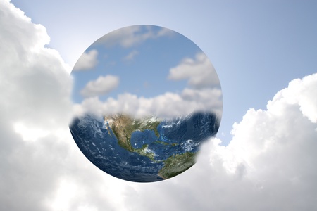 Earth and sky against a bright cloudy skyの写真素材