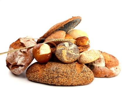 Fresh baked bread and wheat in a studio setting
