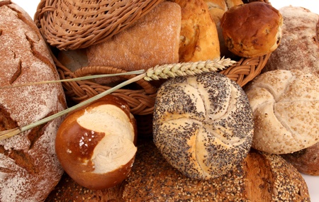 Fresh baked bread and wheat in a studio setting