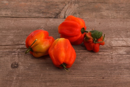 Chili peppers on an rustic wooden table