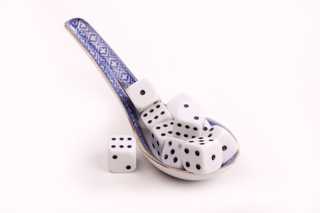 Chinese spoon with character dices over white