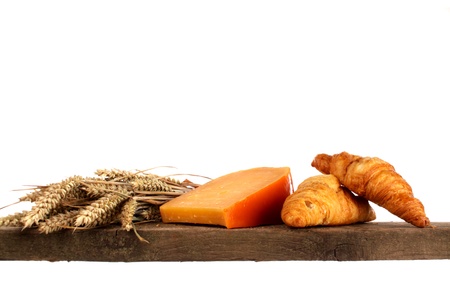 Various kinds of bread loaf and buns on a shelf in a studio settingの写真素材
