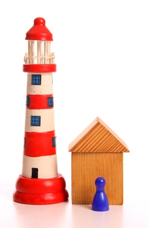 Small toy lighthouse in the studio over whiteの写真素材