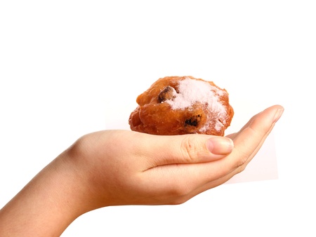 An Oliebol in a young womans handの写真素材