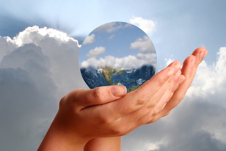 Young womans hand showing the worldの写真素材