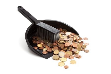 dustpan and brush  with money on a white backgroundの写真素材