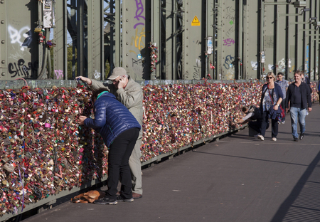 Cologne,Germany,-june 2016: Transportatiion on the river Rine.Thousands of locks on the railway bridgeのeditorial素材