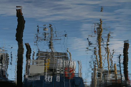 Netherlands, Bruinisse, july 2016: reflections of fishingboats in the harbourのeditorial素材