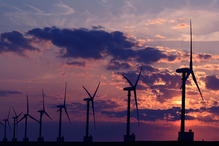 Eemshaven,Groningen, july 2016: Windturbines against sunset in Eemshavenのeditorial素材