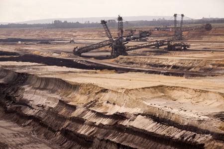 Germany, North Rhine Westphalia, -june 2017:  ground excavator in action moving mullock and soil at open pit coal mine; Germany,for winning brown coalのeditorial素材