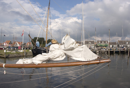 Wooden fishing boats and houses in the port areaのeditorial素材