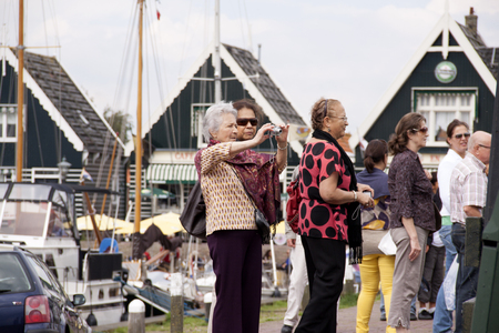 Netherlands,North Holland,Marken, june2016: Tourists in the harbour of Markenのeditorial素材