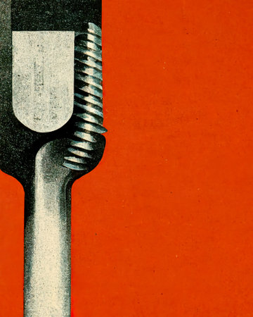 Closeup of a screwdriver on an orange background with copy spaceの素材
