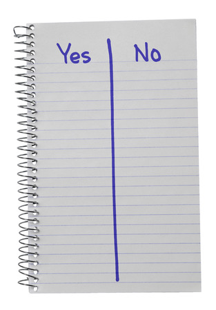 Notebook on a white background counting votes yes or noの写真素材