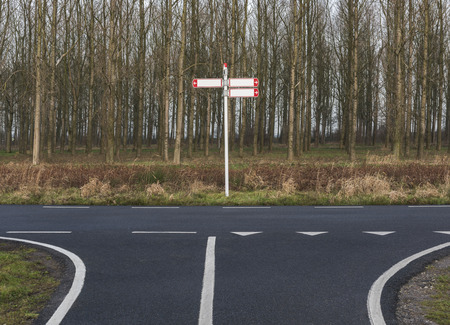 Bicycle path with sign indicating directionsの写真素材