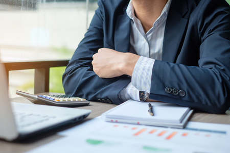 Businessman analysis maketing plan, Accountant calculate financial report, computer with graph chart.  Business, Finance and Accounting conceptsの写真素材