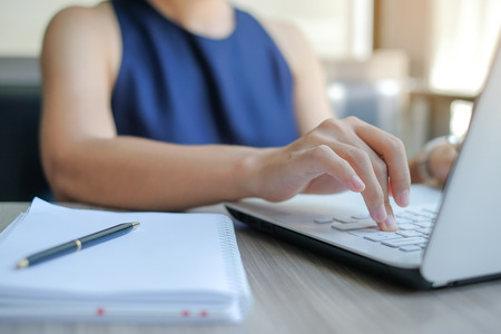 Businesswoman using laptop for analysis maketing plan, Manager calculate financial report and graph chart.  Business, Finance and Accounting conceptsの写真素材
