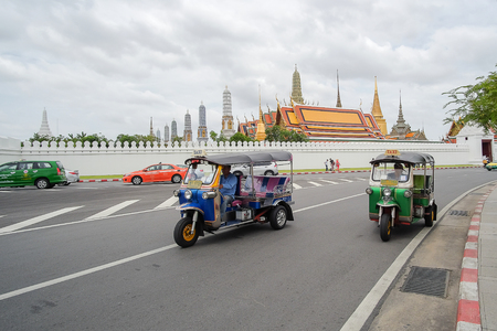 Bangkok, Thailand, 17 June 2018: Tuk Tuk (Thai traditional taxi car) in front of wat phra kaew, sightseeing in Bangkok, Thailandのeditorial素材