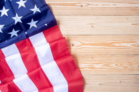flag of the United States of America on wooden background. USA holiday of Veterans, Memorial,...