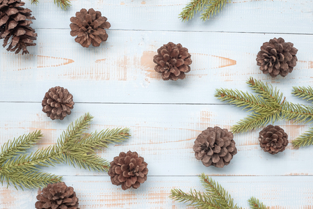 Christmas decoration,  and pine tree branches on wooden background, preparation for holiday concept, Happy New Year and Xmas Holidays. Top view and Copy Space for textの写真素材
