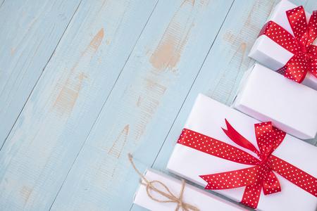 Christmas decoration, gift box and pine tree branches on wooden background, preparation for holiday concept, Happy New Year and Xmas Holidays. Top view and Copy Space for textの写真素材