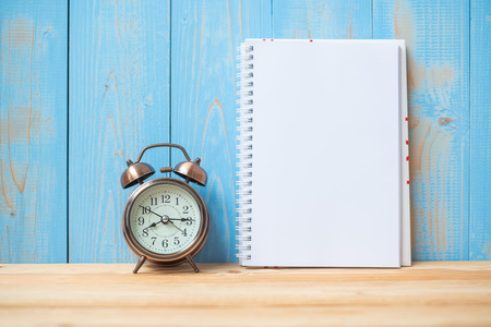 2019 Happy New years with notebook, retro alarm clock on table and copy space. New Start, Resolution, Goals and Mission Conceptの写真素材