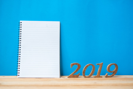 2019 Happy New years with notebook and wooden number on table and copy space. New Start, Resolution, Goals and Mission Conceptの写真素材