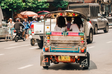 Asian woman travelers inTaxi car  (Tuk Tuk) at Yaowarat road or Chinatown of Bangkok. Bangkok, Thailand, 29 September 2018のeditorial素材