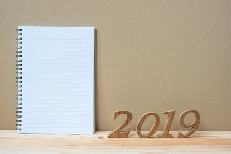 2019 Happy New years with notebook and wooden number on table and copy space. New Start, Resolution, Goals and Mission Conceptの写真素材